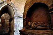 Bagan Myanmar. On the reverse side of the Twin Buddha statues is a parinibbana scene. 